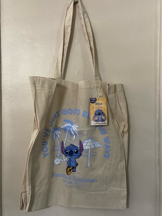 Disney Handbags - Disney Beige Canvas Tote with Blue Stitch Graphic